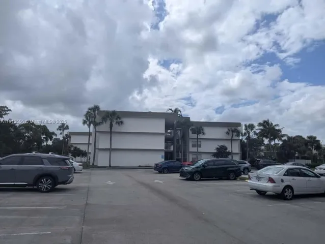 a view of parking space with parked cars