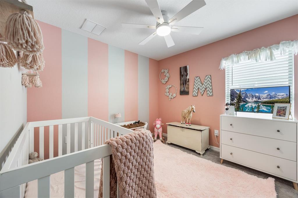 9217 Southwest 58th Circle Ocala, FL 34476 - Photo 14 of 21 a bedroom with a bed and a window