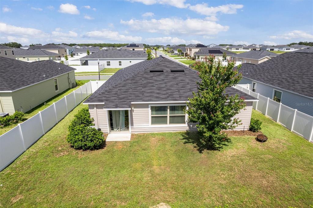 9217 Southwest 58th Circle Ocala, FL 34476 - Photo 21 of 21 a view of a house with a garden and lake view