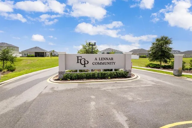 a view of a sign board with a big yard