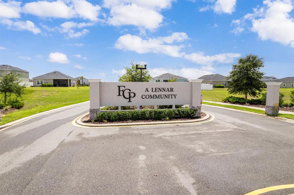 9217 Southwest 58th Circle Ocala, FL 34476 - Photo 5 of 21 a view of a sign board with a big yard