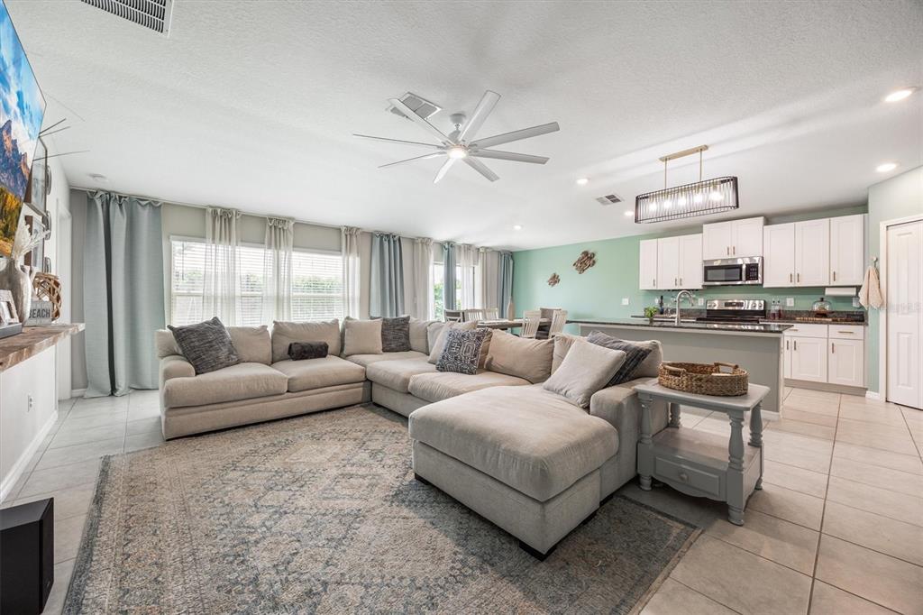 9217 Southwest 58th Circle Ocala, FL 34476 - Photo 9 of 21 a living room with furniture and kitchen view
