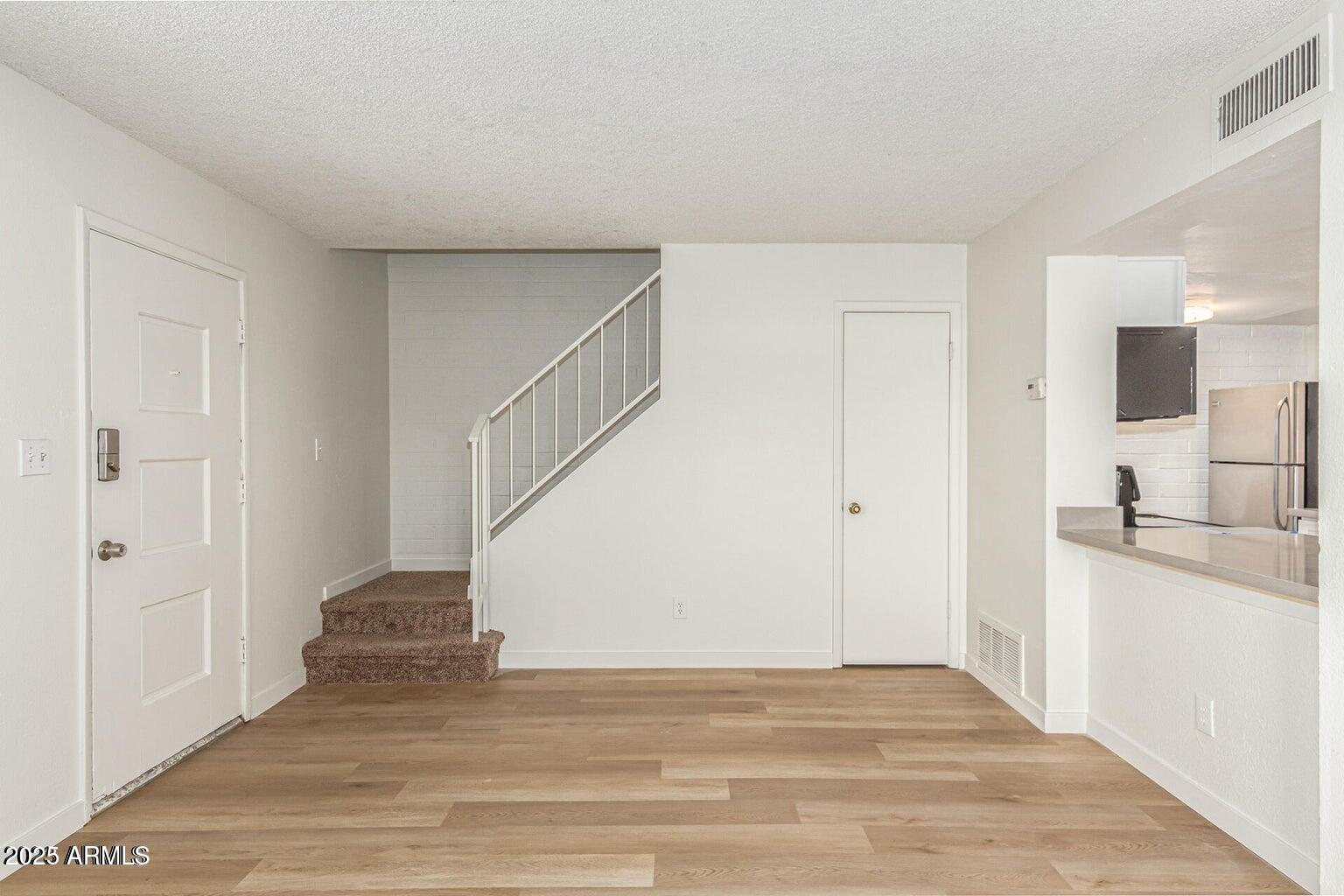 600 South Dobson Road, Unit 69 Mesa, AZ 85202 - Photo 13 of 24 a view of a kitchen with a sink and a refrigerator