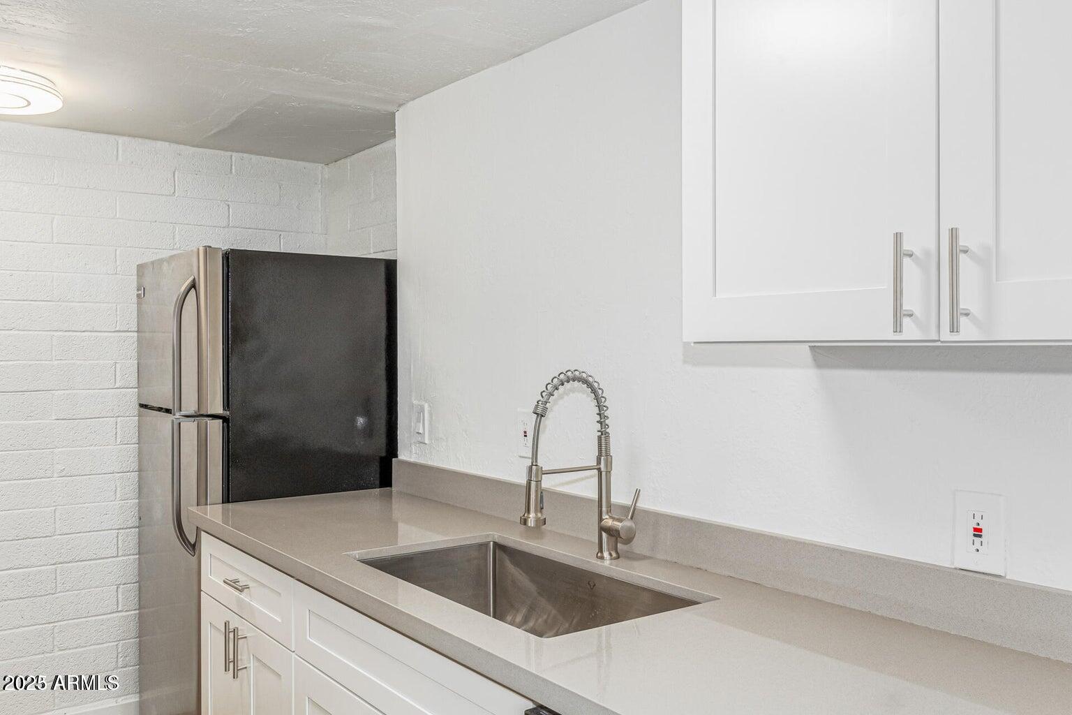 600 South Dobson Road, Unit 69 Mesa, AZ 85202 - Photo 19 of 24 a close view of a sink and a refrigerator