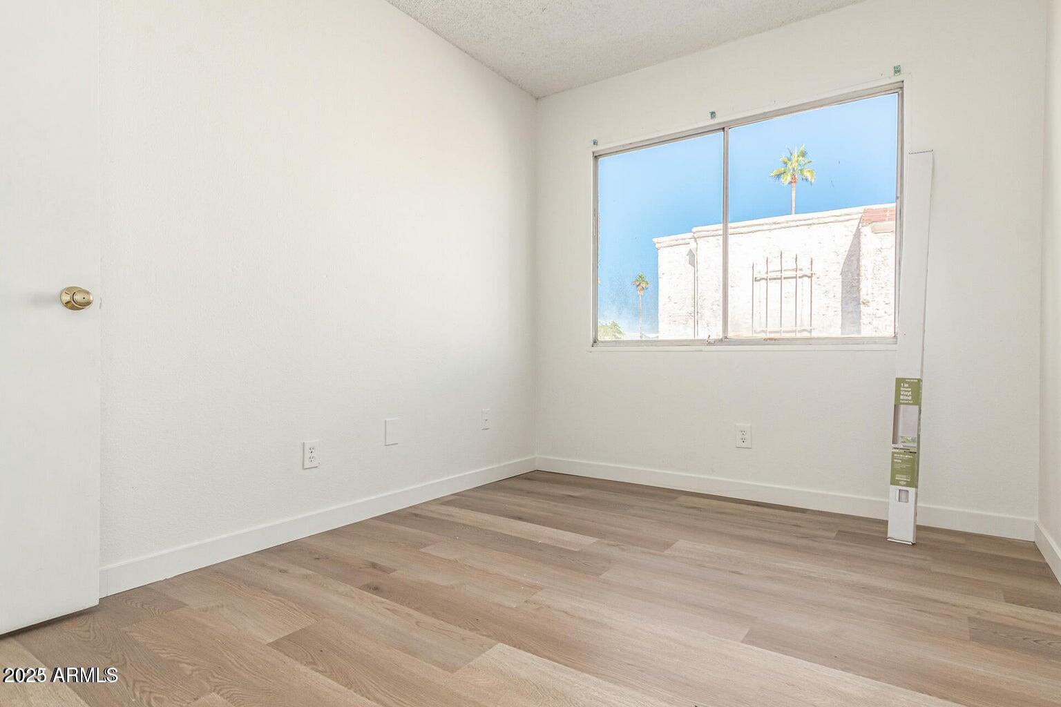 600 South Dobson Road, Unit 69 Mesa, AZ 85202 - Photo 3 of 24 an empty room with a window