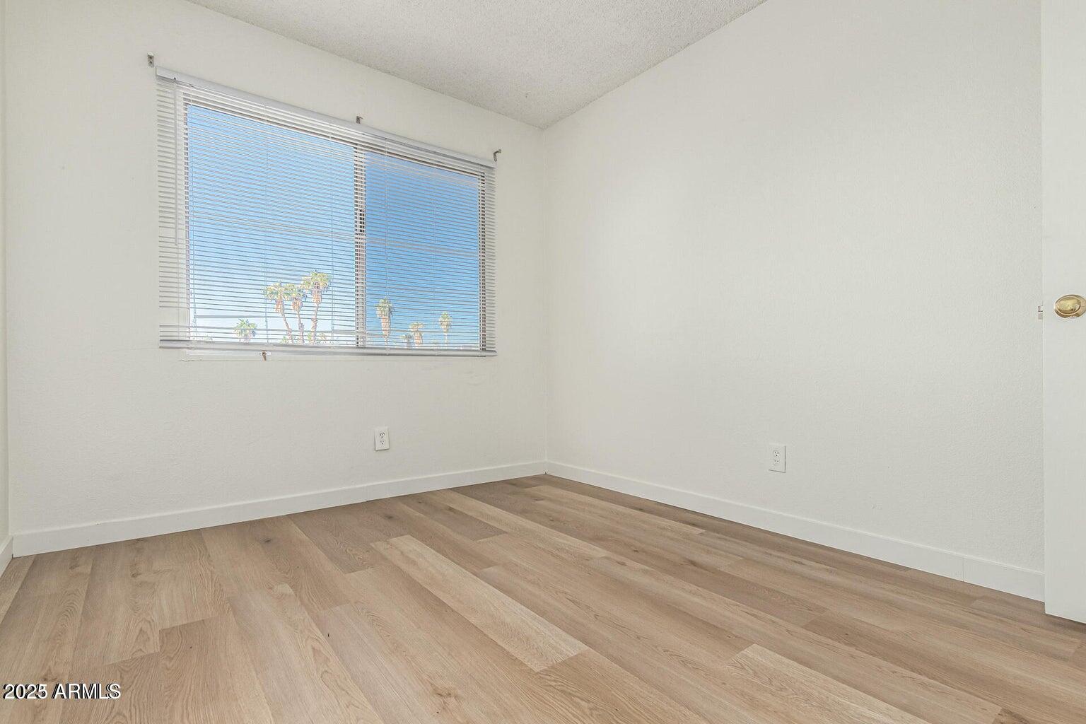 600 South Dobson Road, Unit 69 Mesa, AZ 85202 - Photo 8 of 24 an empty room with a window