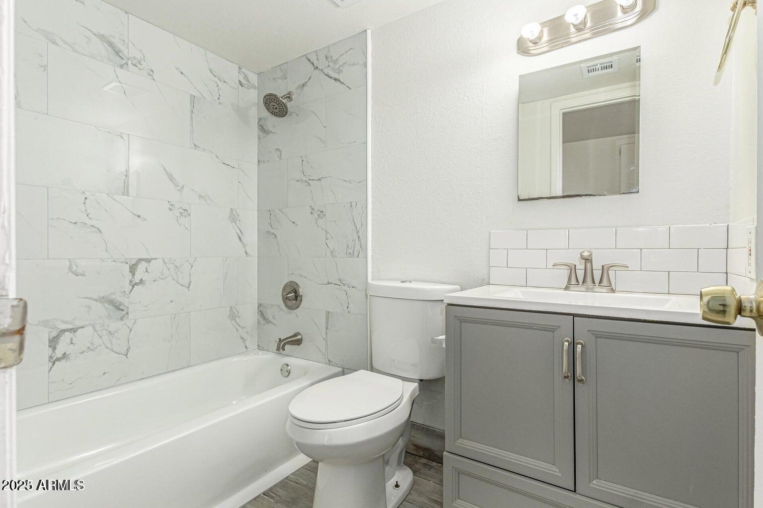 600 South Dobson Road, Unit 69 Mesa, AZ 85202 - Photo 9 of 24 a bathroom with a sink a toilet and shower
