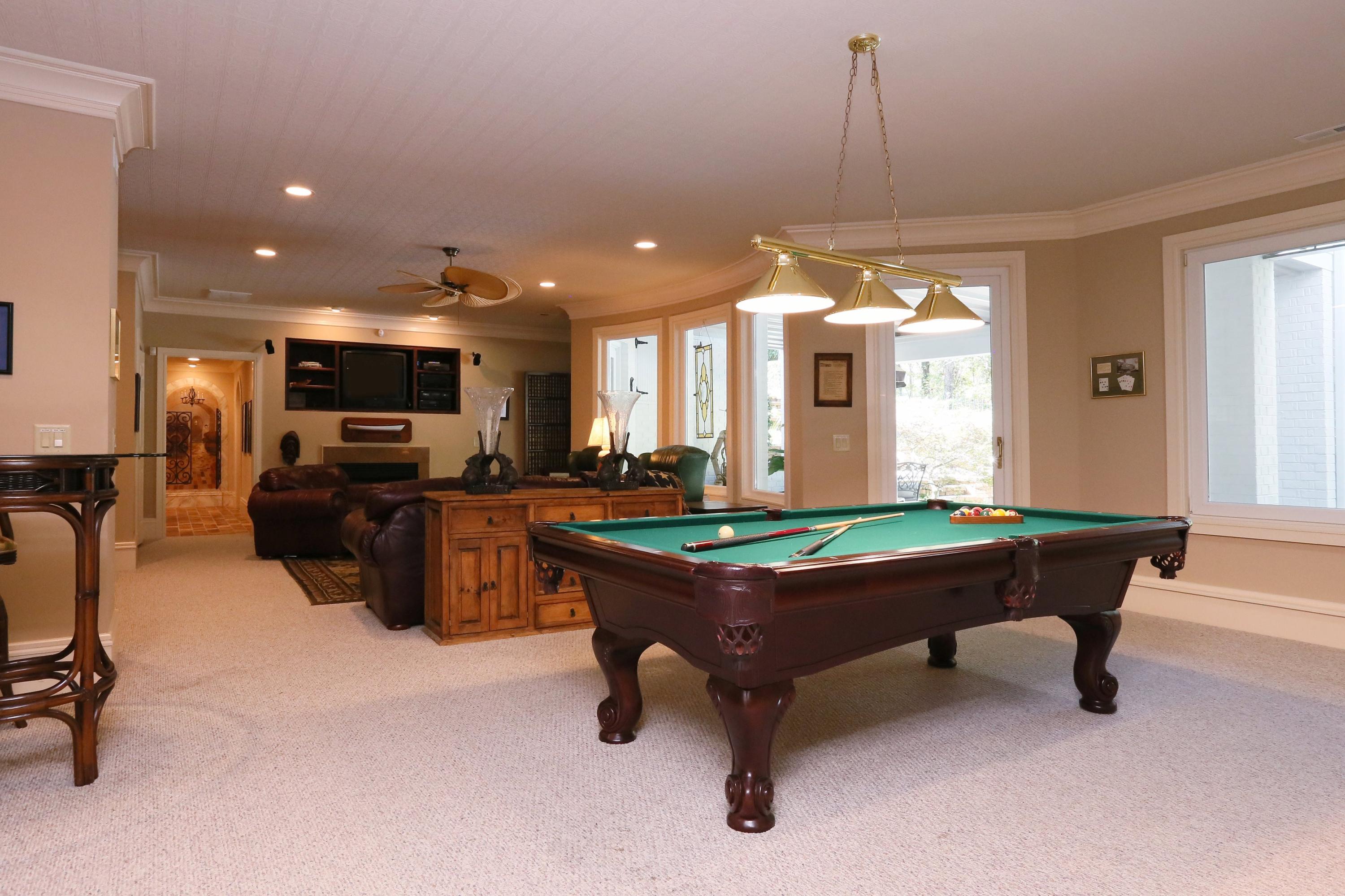 60 Inverrary Road Pinehurst, NC 28374 - Photo 17 of 32 Lower Level Recreation Room, Dry Bar, Sauna, Wine Cellar, 2 Bedrooms, 2 Full Baths with Heated Tile Floors, 2 Car Garage with Full Bath and Dog Wash Area, Walk in Storage.