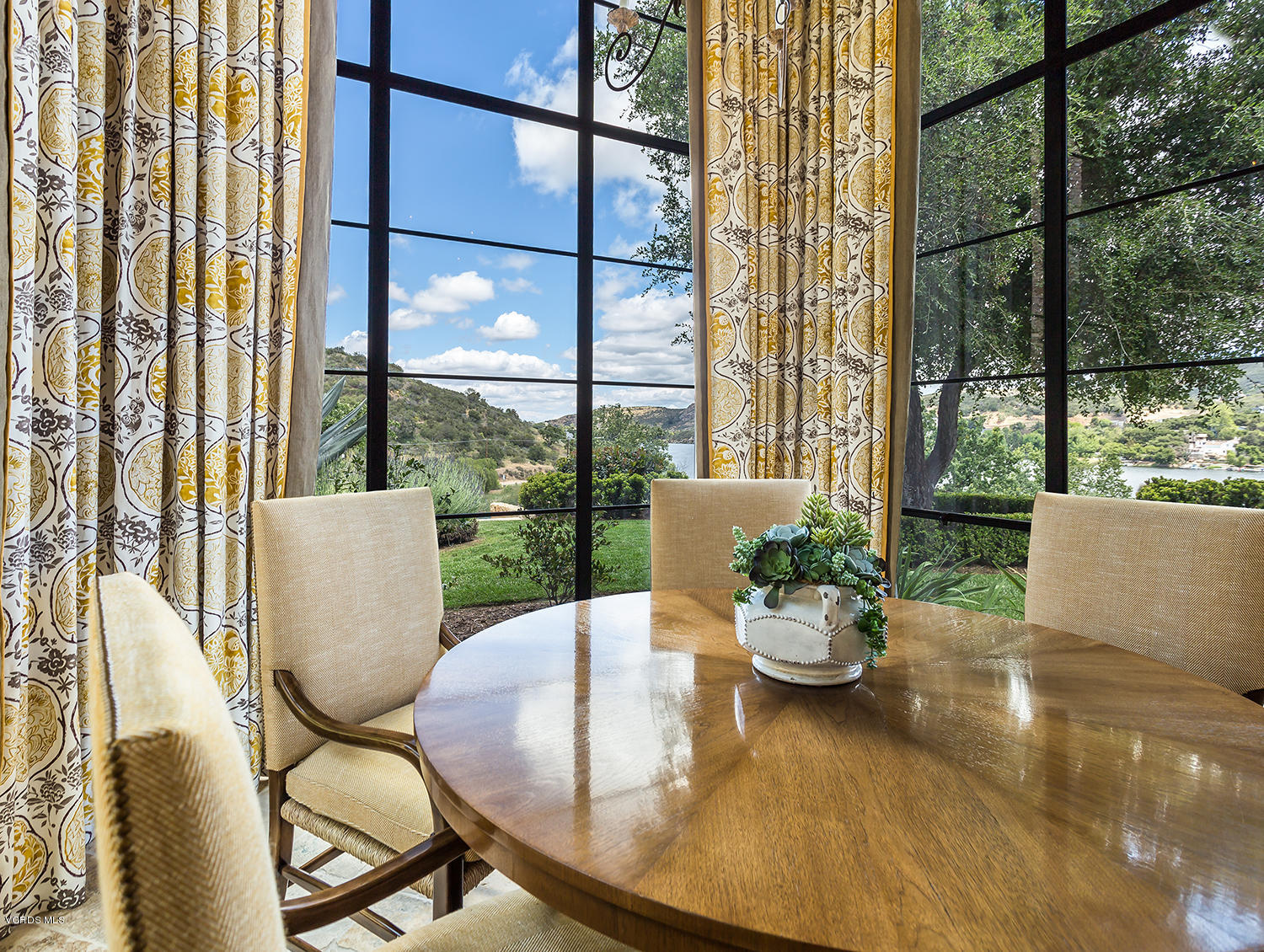 100 West Potrero Road Thousand Oaks, CA 91361 - Photo 15 of 67 a view of a dining room with furniture wooden floor and a potted plant
