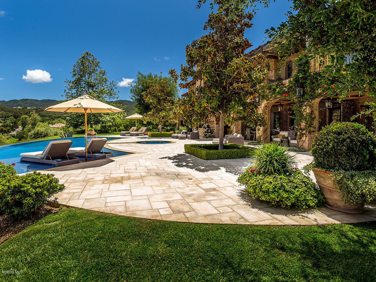 100 West Potrero Road Thousand Oaks, CA 91361 - Photo 49 of 67 a view of a backyard with plants and patio