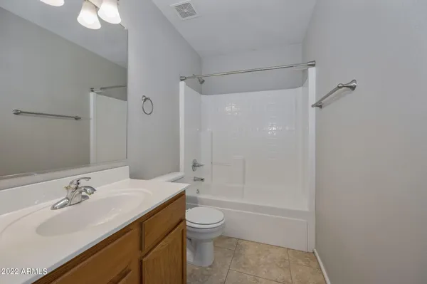 a bathroom with a sink toilet tub and shower