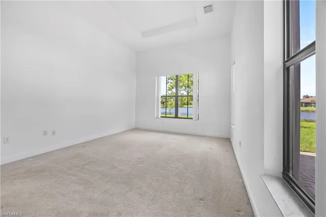 a view of an empty room and a window