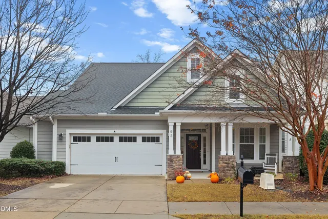 a front view of a house with garage