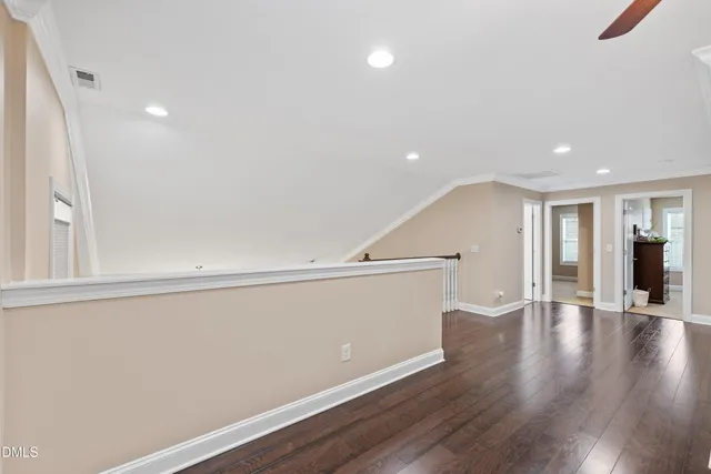 a view of staircase with white walls and a window
