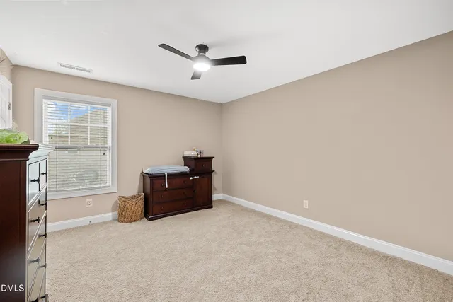 a view of an empty room and closet