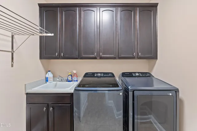 a room with lots of wooden furniture and a view of living room