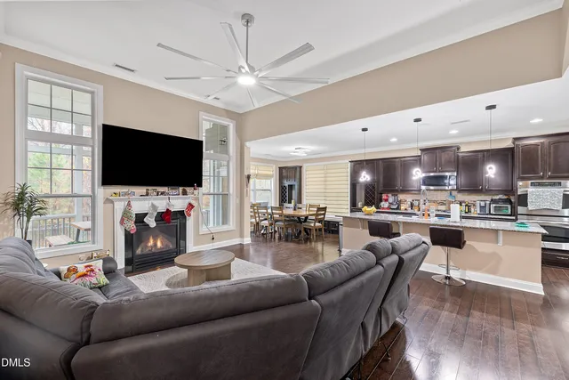 a bed sitting in a spacious bedroom next to a window