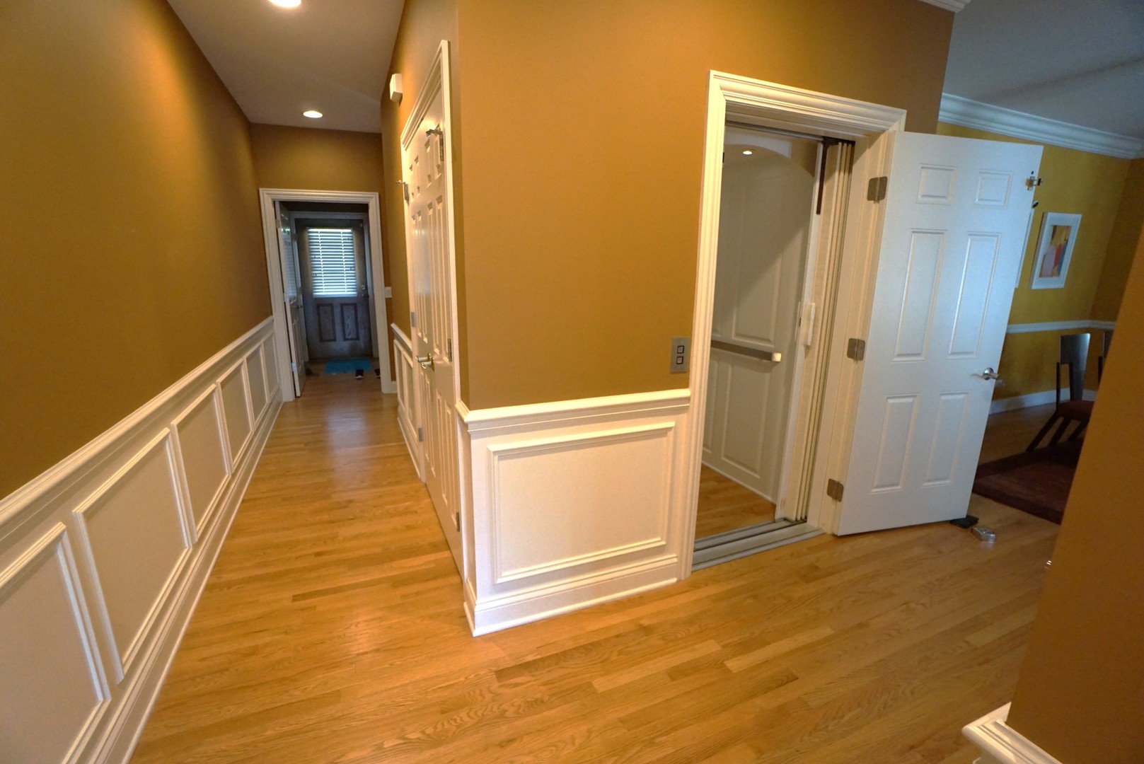 8 North Smith Street Palatine, IL 60067 - Photo 11 of 46 a view of a hallway with wooden floor and staircase