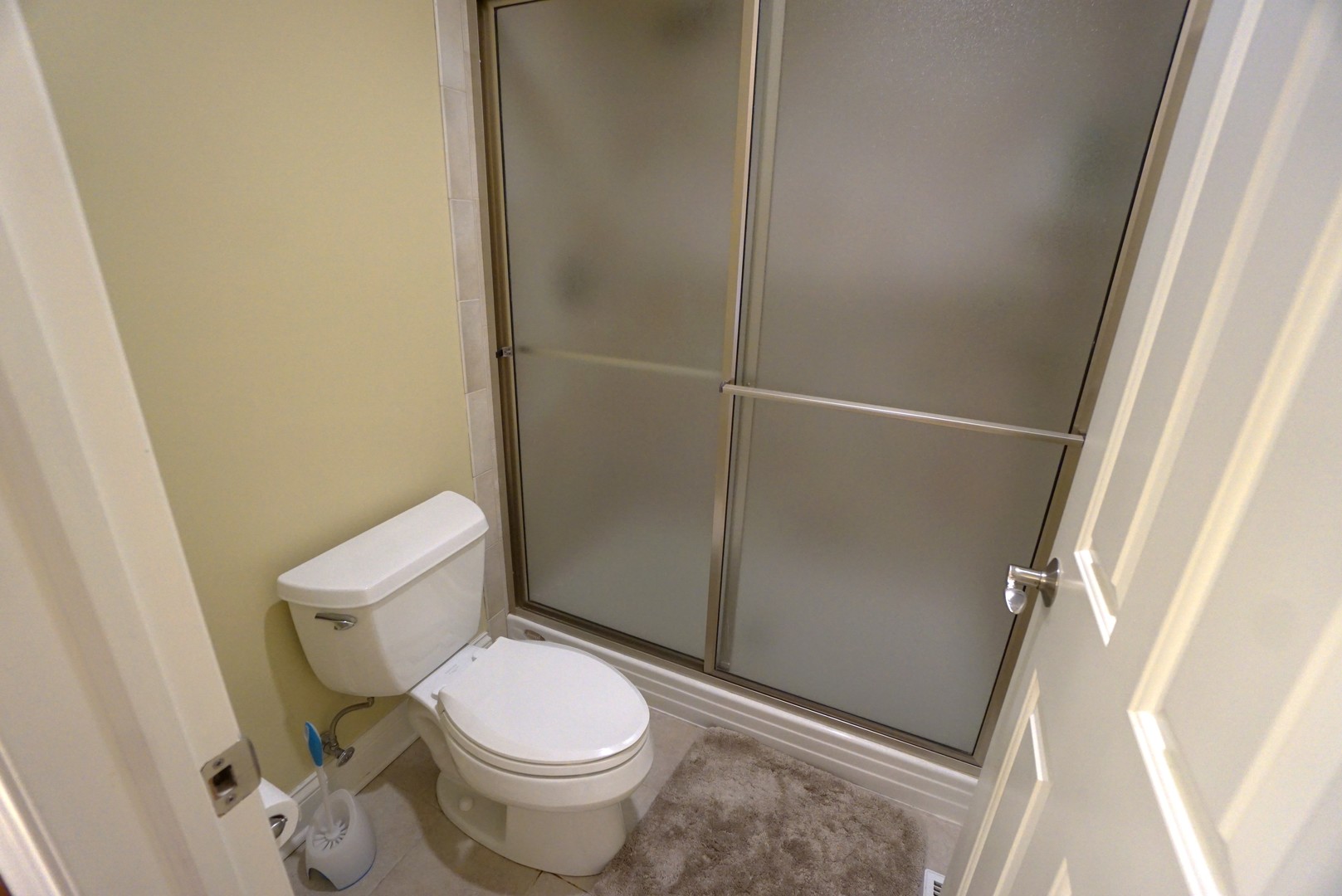 8 North Smith Street Palatine, IL 60067 - Photo 20 of 46 a white toilet sitting next to a shower
