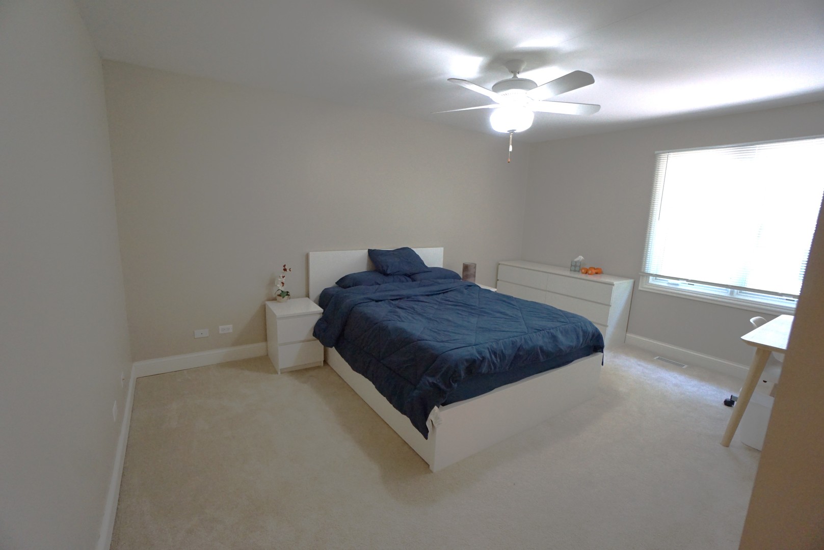 8 North Smith Street Palatine, IL 60067 - Photo 27 of 46 a spacious bedroom with a bed and a chandelier