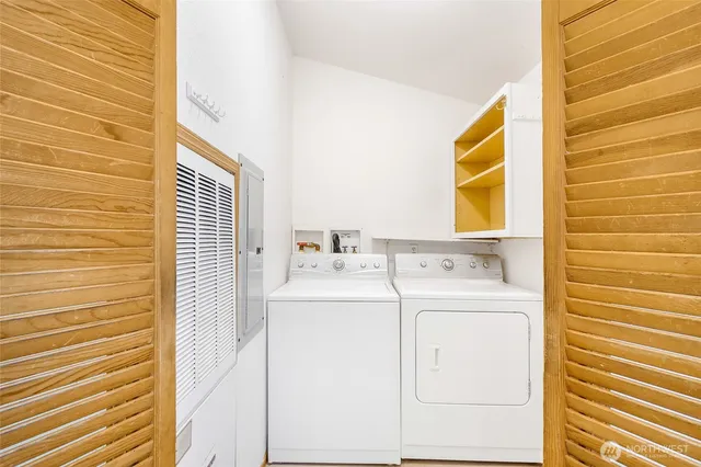 a utility room with dryer and washer