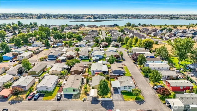 an aerial view of residential houses with outdoor space