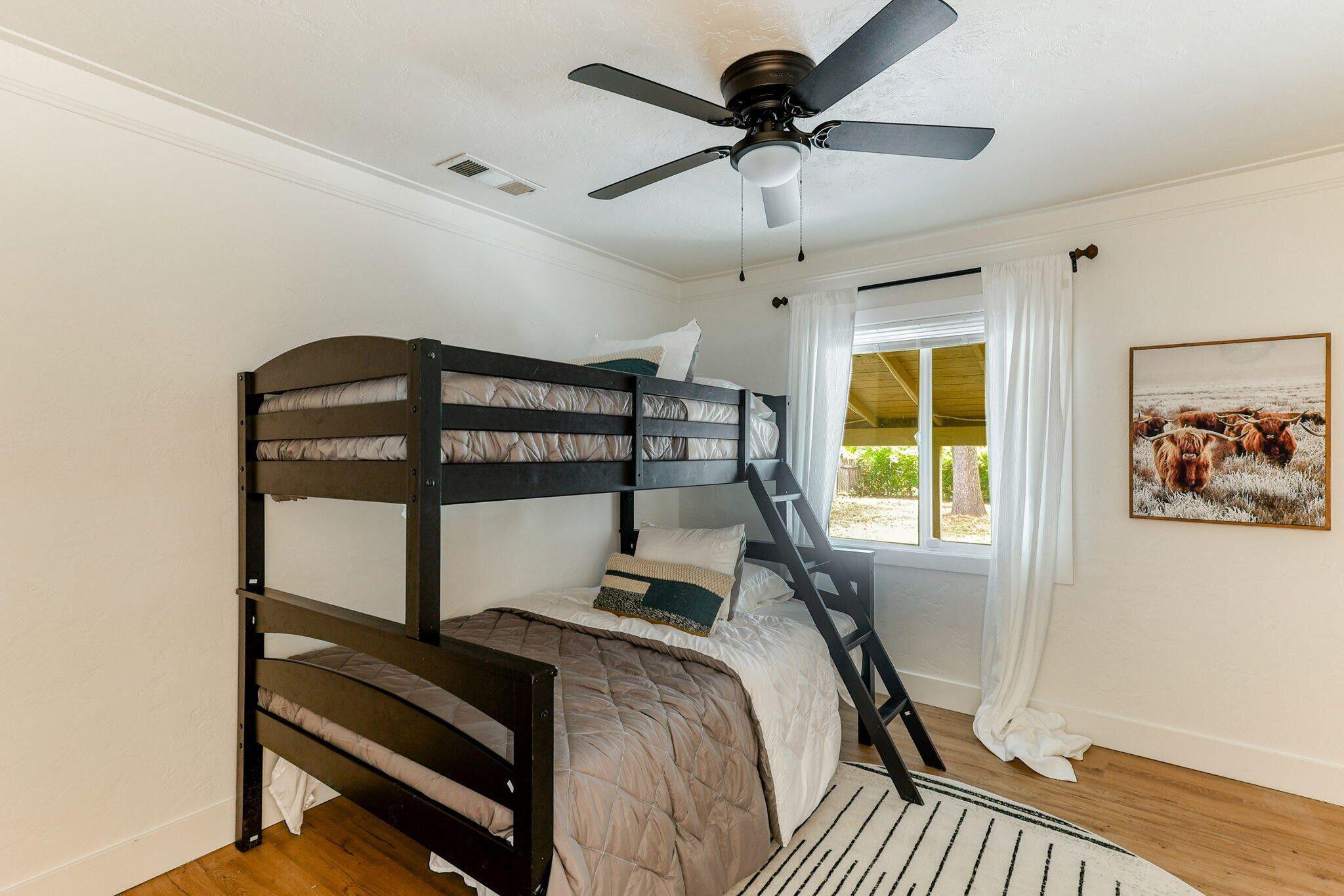 1005 Gold Street Redding, CA 96001 - Photo 19 of 26 a bedroom with a bed and a window