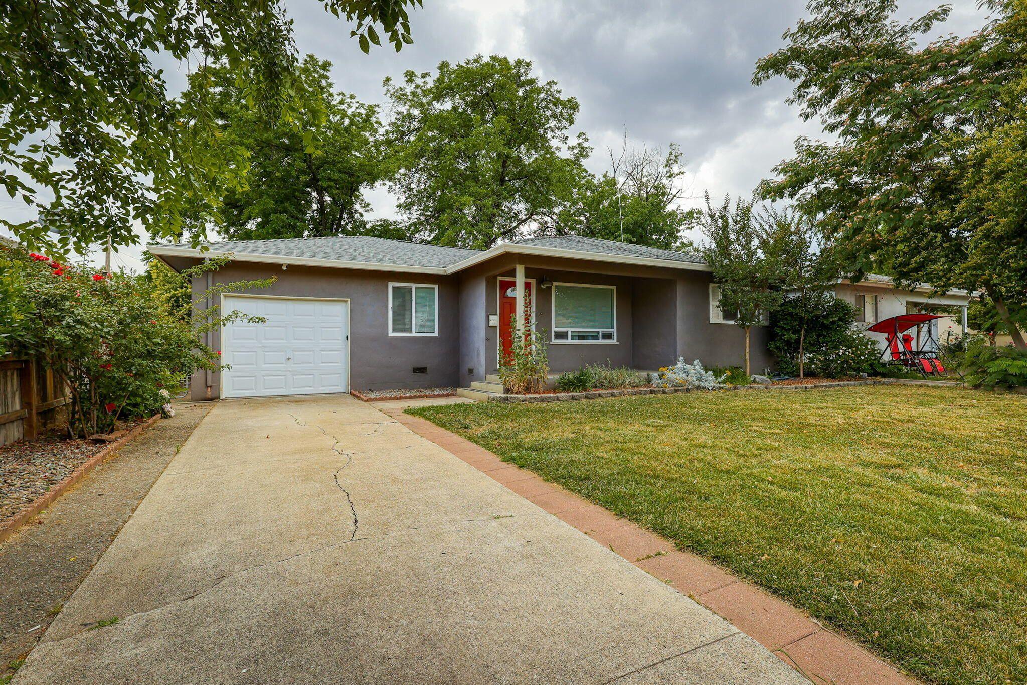 1005 Gold Street Redding, CA 96001 - Photo 2 of 26 a front view of house with yard and trees