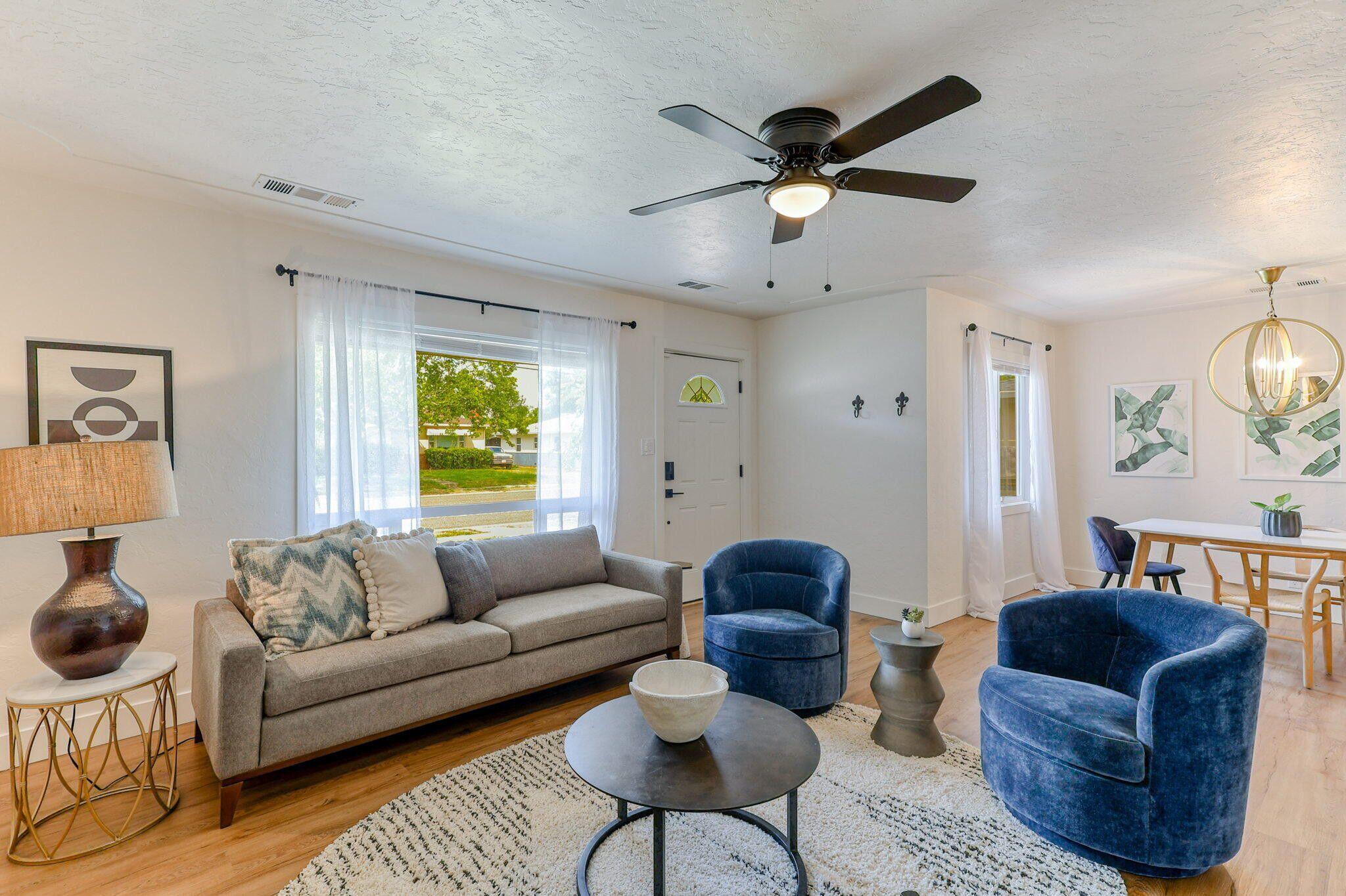 1005 Gold Street Redding, CA 96001 - Photo 3 of 26 a living room with furniture a ceiling fan and a window