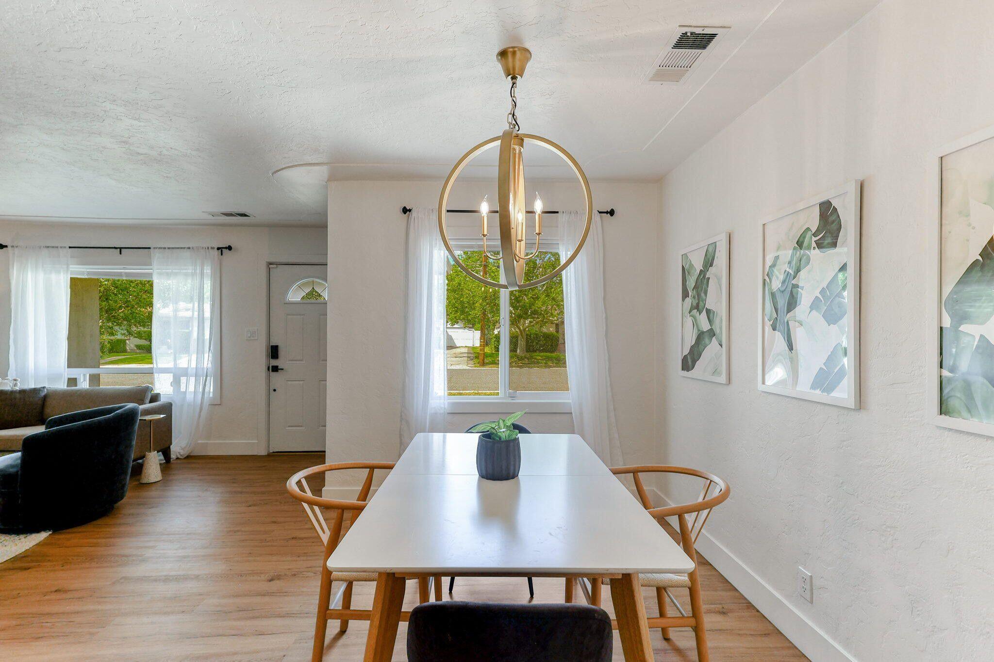 1005 Gold Street Redding, CA 96001 - Photo 7 of 26 a view of a dining room with furniture window and wooden floor