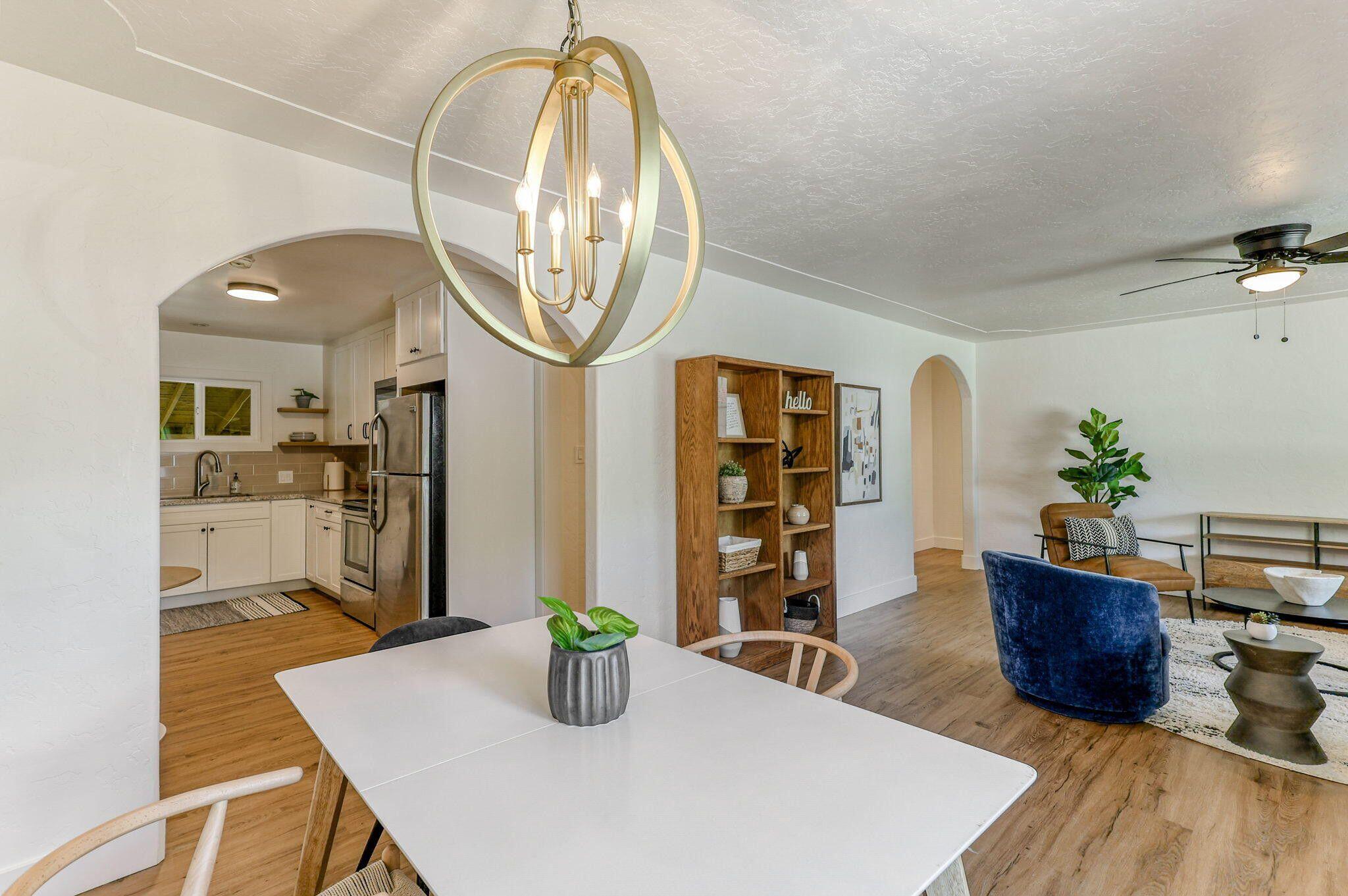 1005 Gold Street Redding, CA 96001 - Photo 8 of 26 a living room with dining table and wooden floor