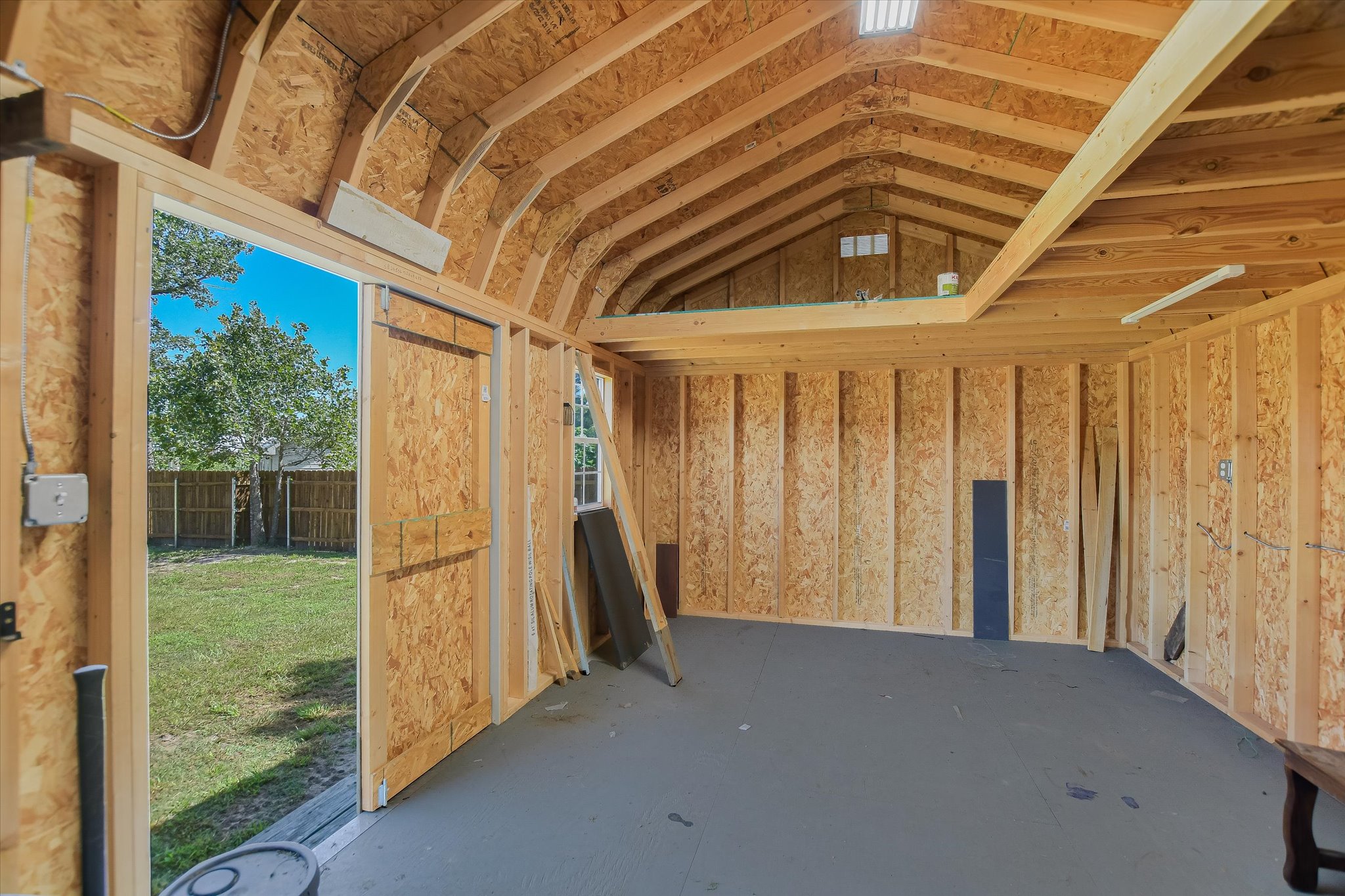 218 Cardinal Loop Paige, TX 78659 - Photo 18 of 22 A large outbuilding provides flexible space.