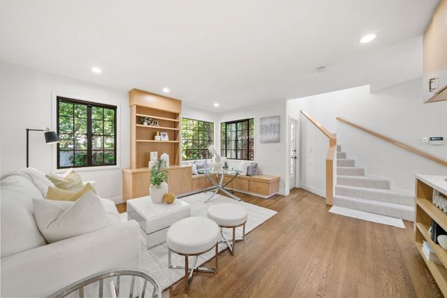 a kitchen with stainless steel appliances granite countertop a sink and stove
