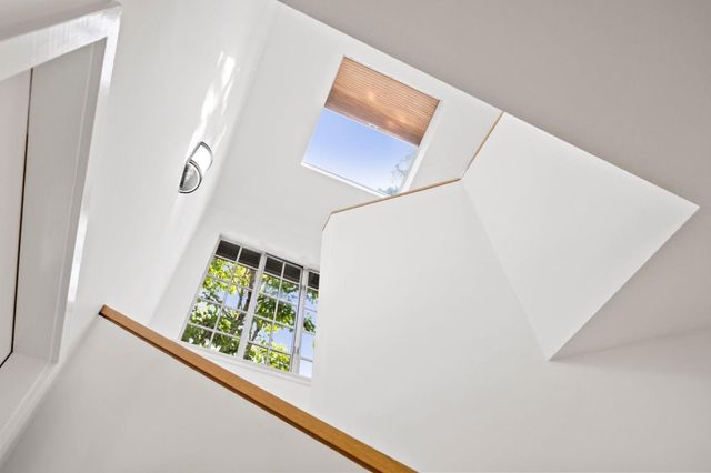 a bedroom with a bed and couch