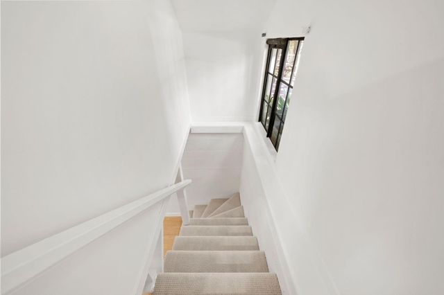 a spacious bathroom with a double vanity sink and a mirror