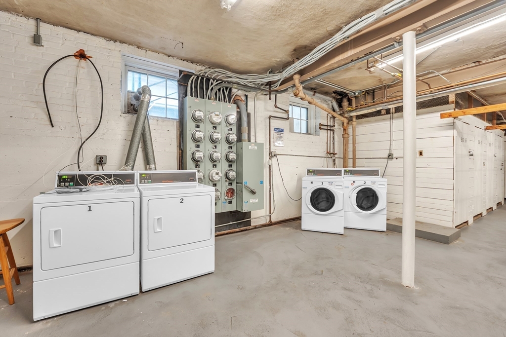 56 Elm Street, Unit 1 Worcester, MA 01609 - Photo 18 of 20 a utility room with dryer and washer