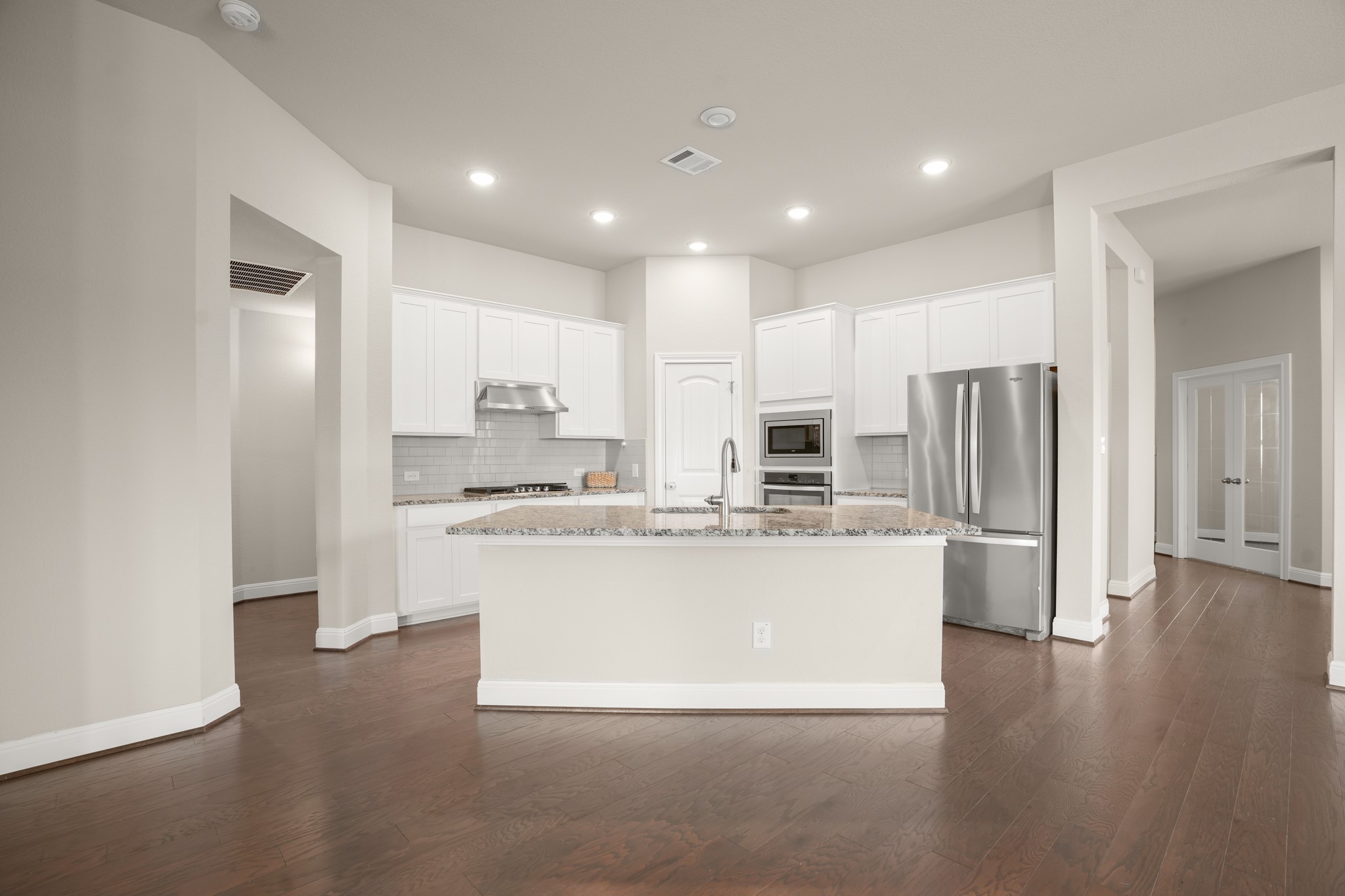 2209 Hat Bender Loop Round Rock, TX 78664 - Photo 2 of 25 a view of kitchen with stainless steel appliances refrigerator stove microwave and cabinets