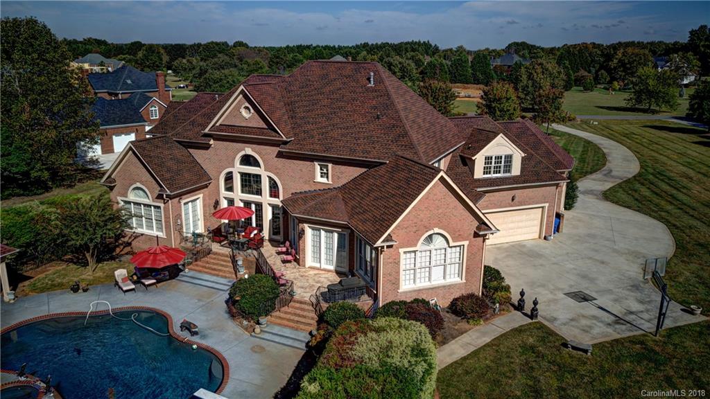 an aerial view of a house with a garden