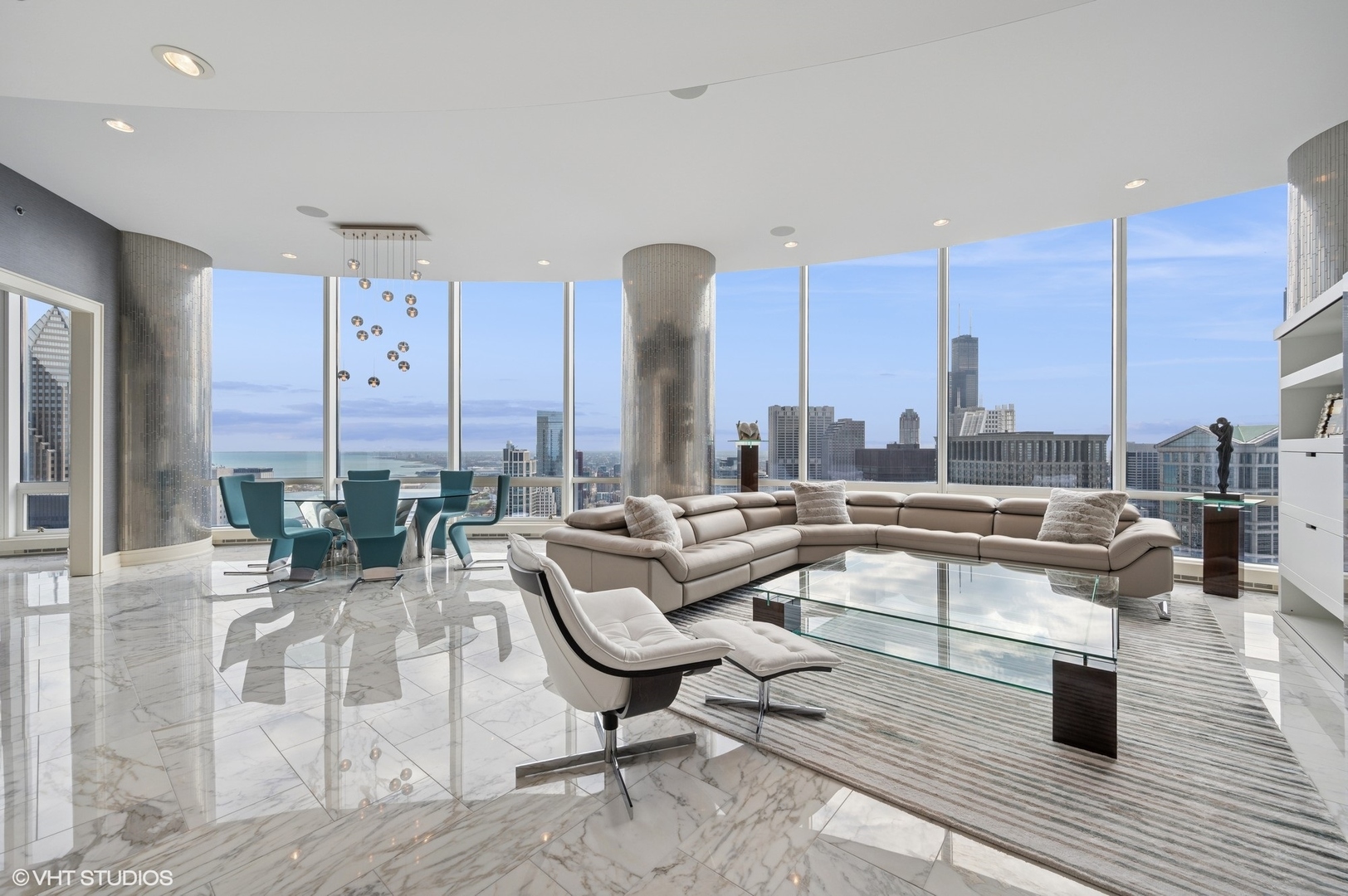 401 North Wabash Avenue, Unit 49G Chicago, IL 60611 - Photo 2 of 60 a living room with couches chairs and large glass view with wooden floor