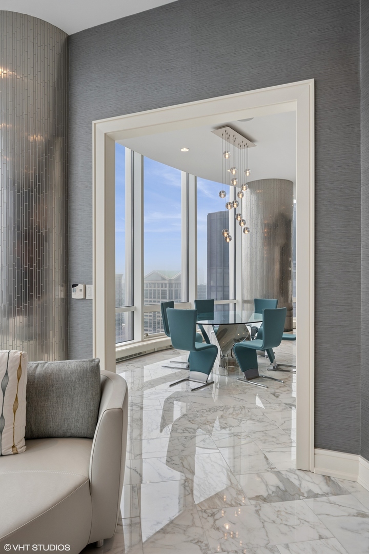 401 North Wabash Avenue, Unit 49G Chicago, IL 60611 - Photo 30 of 60 a living room with furniture and large windows