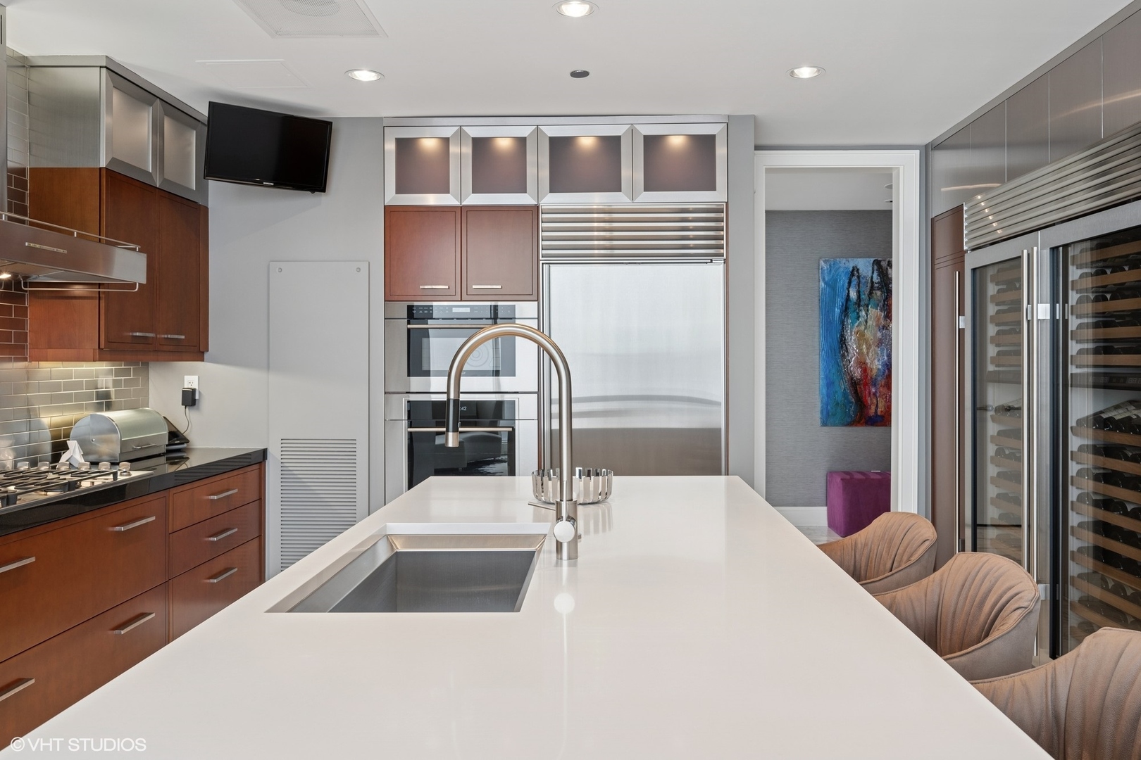 401 North Wabash Avenue, Unit 49G Chicago, IL 60611 - Photo 34 of 60 a kitchen with stainless steel appliances kitchen island granite countertop a sink and cabinets