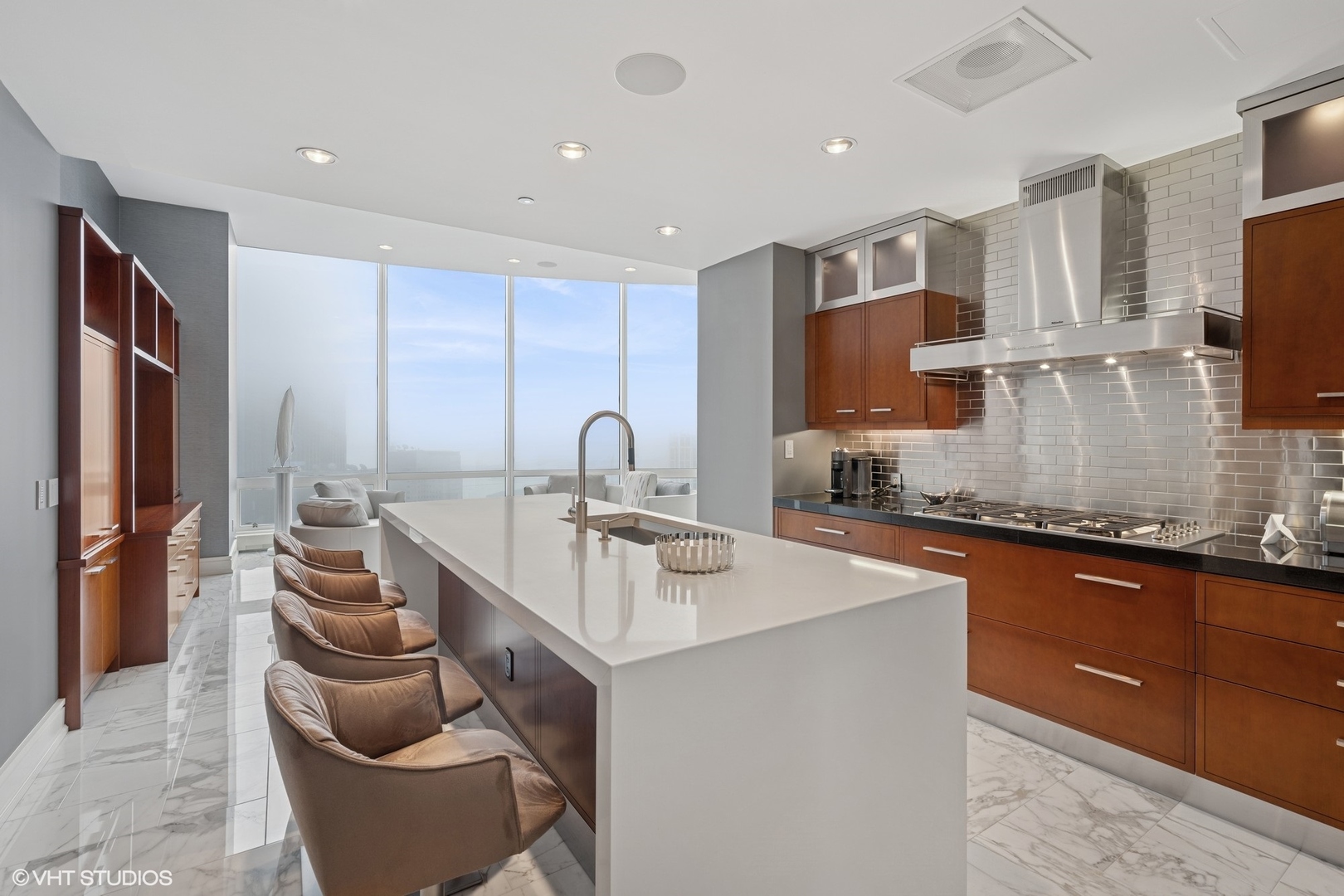 401 North Wabash Avenue, Unit 49G Chicago, IL 60611 - Photo 35 of 60 a kitchen with stainless steel appliances granite countertop a sink and a refrigerator