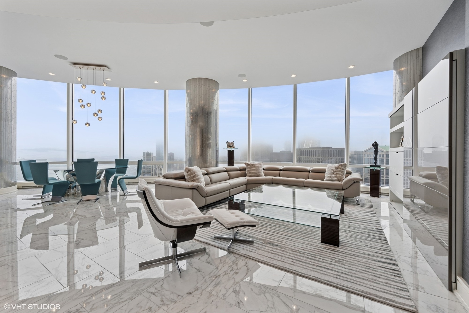 401 North Wabash Avenue, Unit 49G Chicago, IL 60611 - Photo 40 of 60 a living room with couches and a dining table with kitchen view