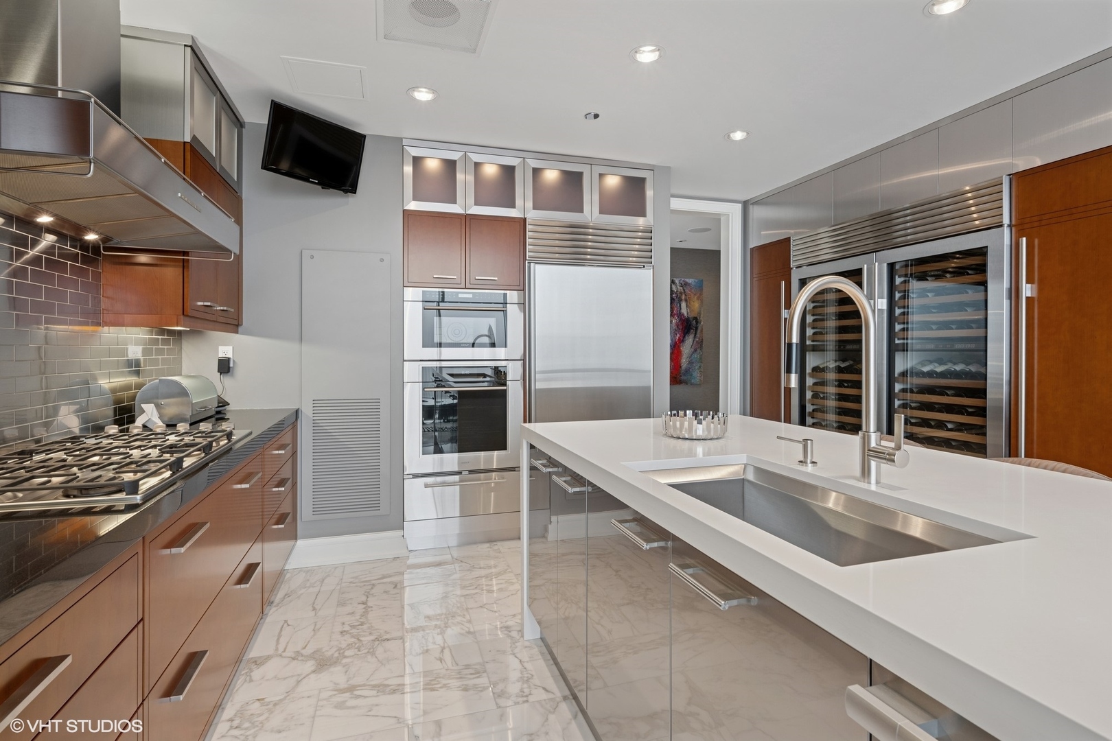 401 North Wabash Avenue, Unit 49G Chicago, IL 60611 - Photo 43 of 60 a large kitchen with stainless steel appliances granite countertop a sink and cabinets