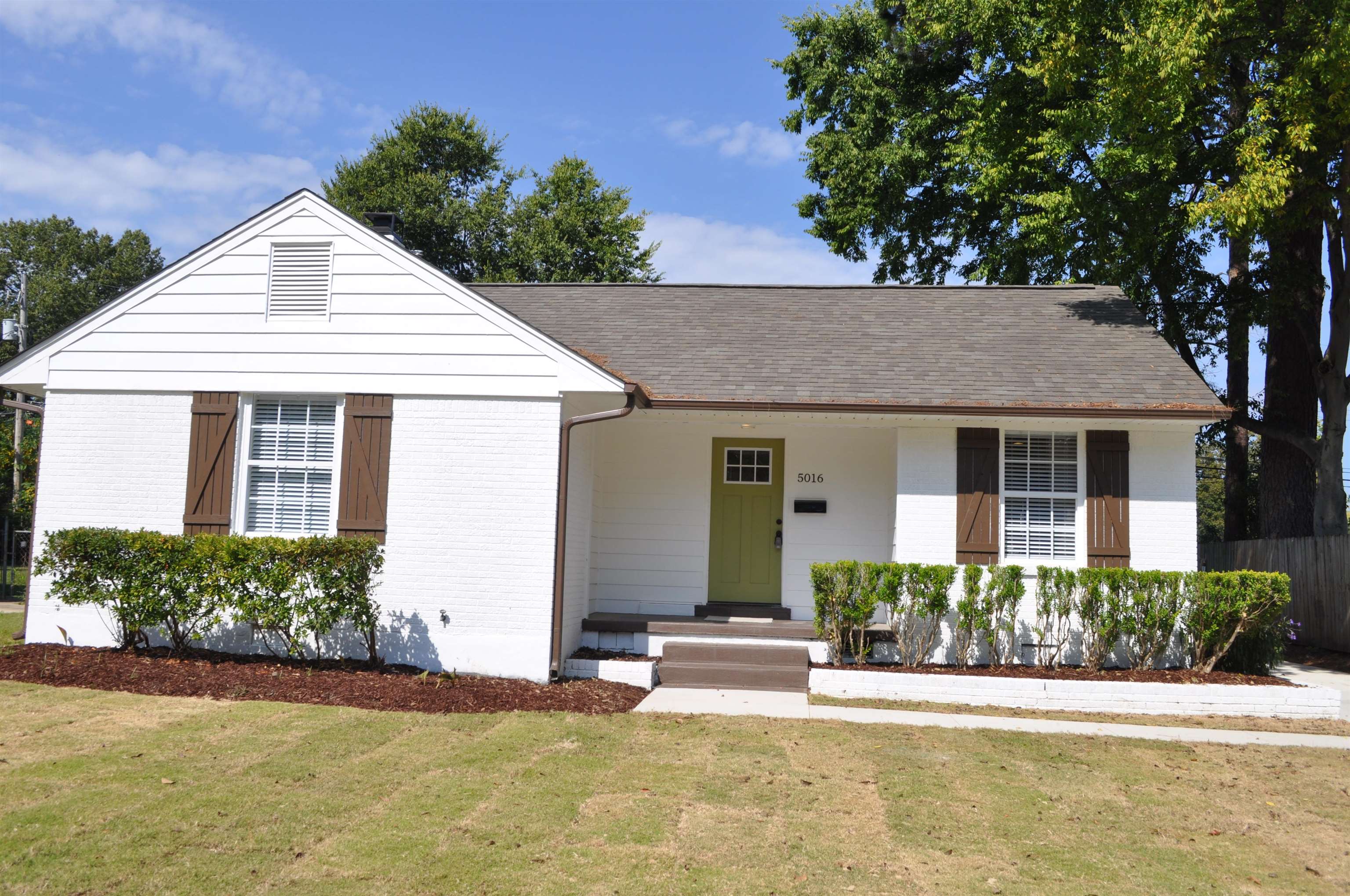 front view of a house with a yard