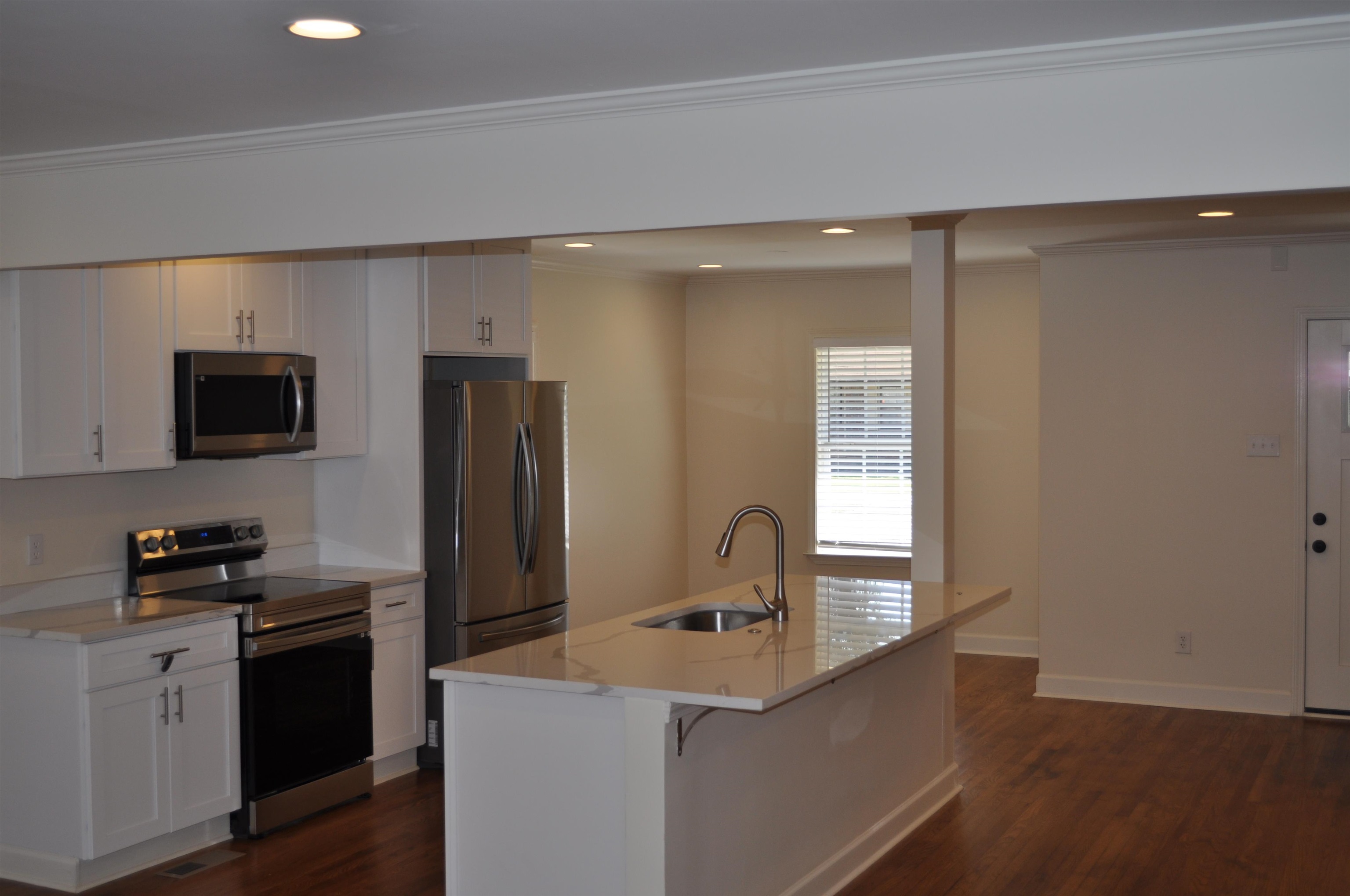 5016 Princeton Road Memphis, TN 38117 - Photo 11 of 20 a kitchen with a refrigerator and a stove top oven