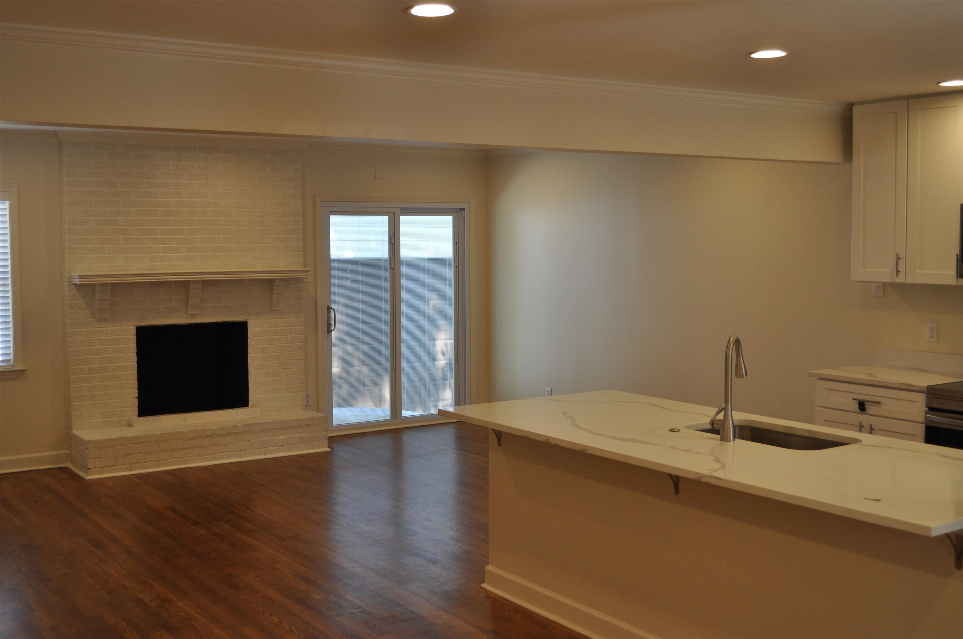 5016 Princeton Road Memphis, TN 38117 - Photo 12 of 20 a view of a kitchen with a sink and a fireplace