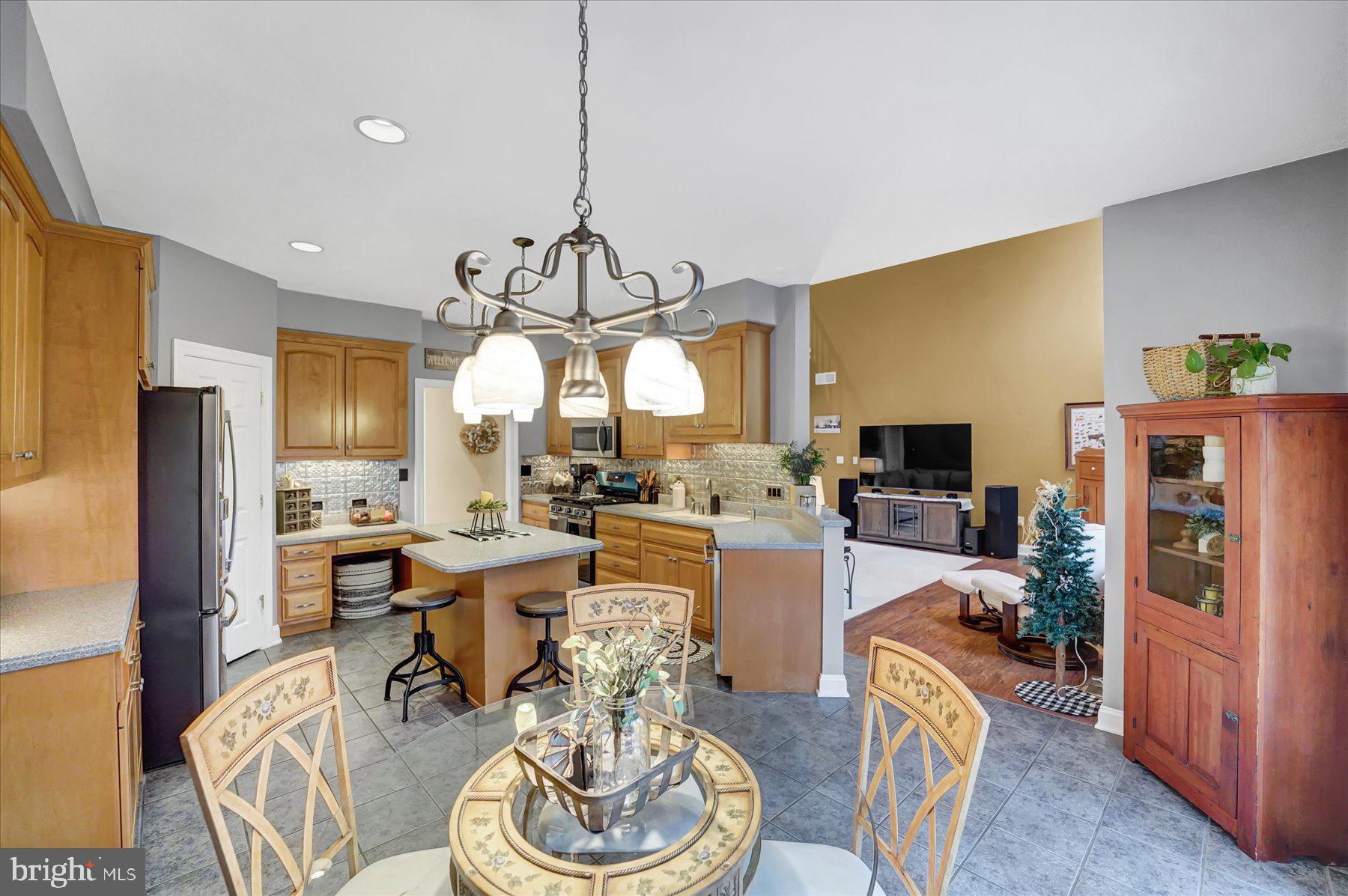 503 Robin Road Bellefonte, PA 16823 - Photo 19 of 72 a view of a dining room with furniture a chandelier and wooden floor