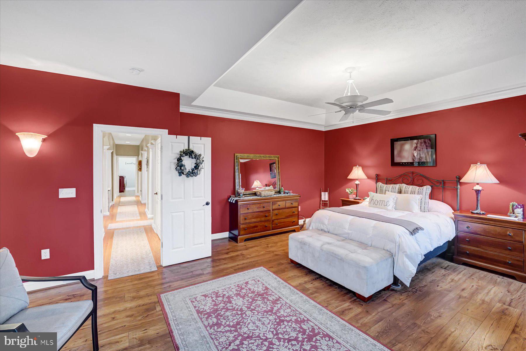503 Robin Road Bellefonte, PA 16823 - Photo 27 of 72 a spacious bedroom with a bed and wooden floor