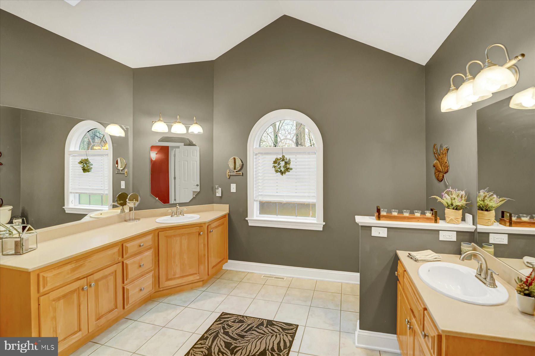 503 Robin Road Bellefonte, PA 16823 - Photo 32 of 72 a spacious bathroom with a double vanity sink and a mirror